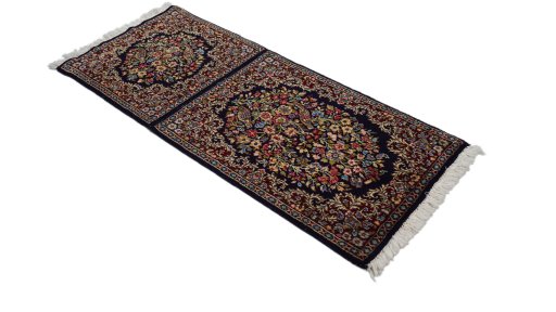 Corner detail of 1970s Kerman rug showing border pattern and Wool pile