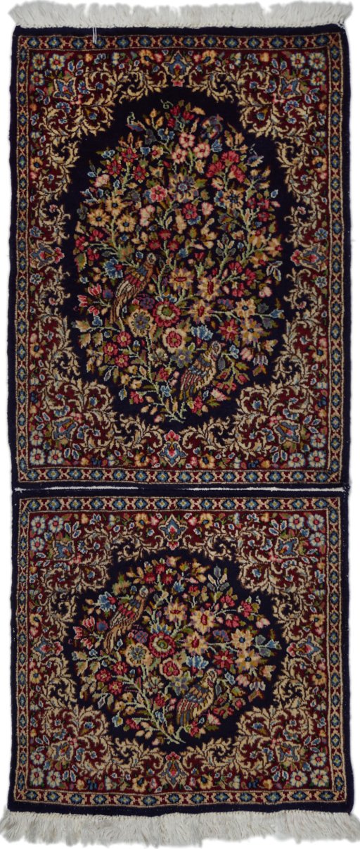 Full view of 1970s Kerman rug from Iran / Persia, 130 × 55 cm in Black tones