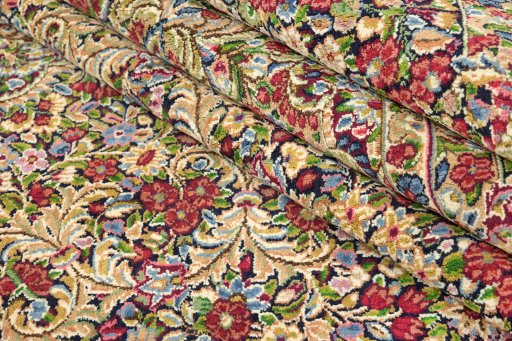 Corner detail of 1970s Kerman rug showing border pattern and Wool pile