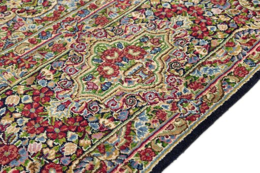 Close-up detail of 1970s Kerman rug from Iran / Persia showing Wool weave