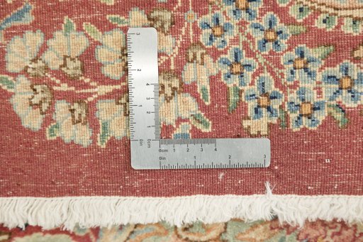 Close-up detail of 1950s Kerman rug from Iran / Persia showing Wool weave