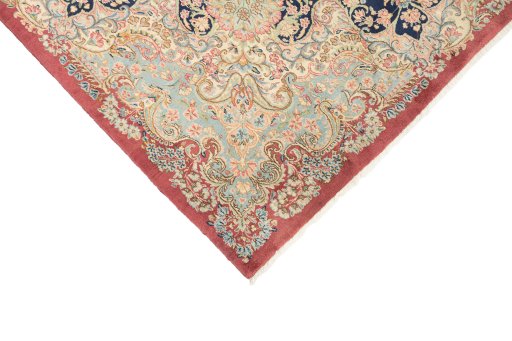 Backside of handmade 1950s Kerman rug showing knot structure and weave density