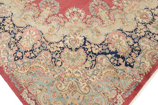 Full view of 1950s Kerman rug from Iran / Persia, 415 × 310 cm in Red tones