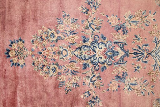 Corner detail of 1950s Kerman rug showing border pattern and Wool pile