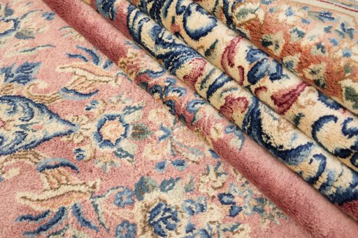 Backside of handmade 1950s Kerman rug showing knot structure and weave density