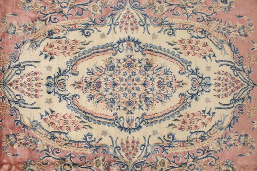 Full view of 1950s Kerman rug from Iran / Persia, 655 × 360 cm in Red tones