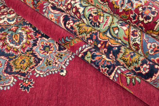 Corner detail of 1950s Kerman rug showing border pattern and Wool pile