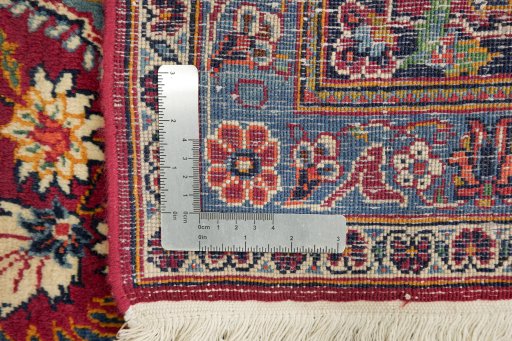 Close-up detail of 1950s Kerman rug from Iran / Persia showing Wool weave