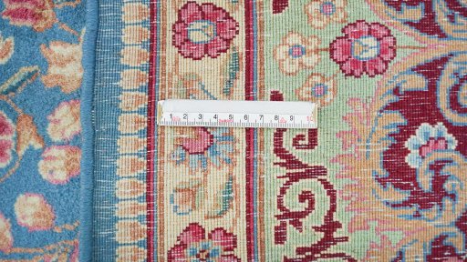 Corner detail of 1960s Kerman rug showing border pattern and Wool pile