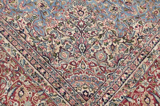 Corner detail of 1960s Kerman rug showing border pattern and Wool pile