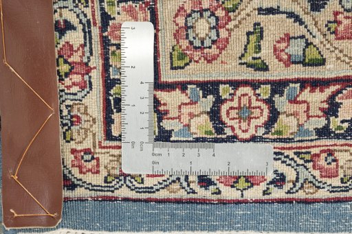 Close-up detail of 1960s Kerman rug from Iran / Persia showing Wool weave