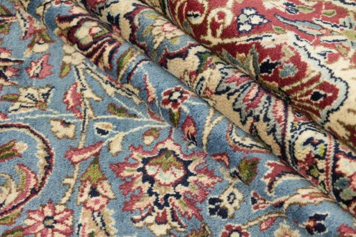 Surface texture of 1960s Kerman rug with natural Wool and intricate pattern