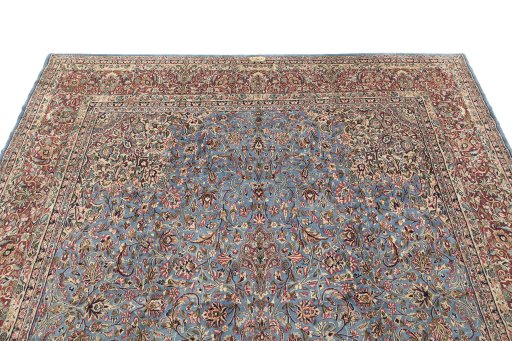 Surface texture of 1960s Kerman rug with natural Wool and intricate pattern