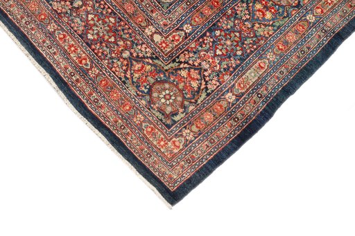 Backside of handmade 1900s Kerman rug showing knot structure and weave density