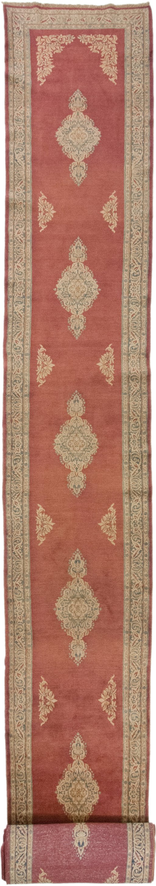 Full view of 1950s Kerman rug from Iran / Persia, 1212 × 107 cm in Red tones