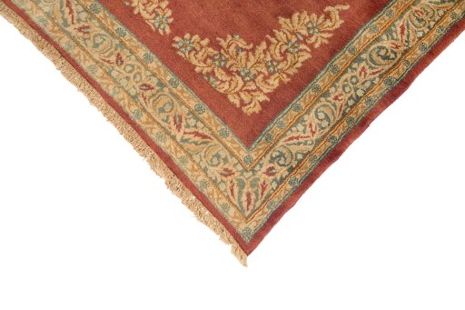 Corner detail of 1950s Kerman rug showing border pattern and Wool pile