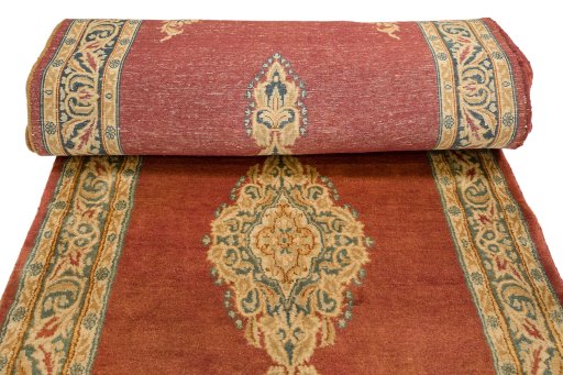 Full view of 1950s Kerman rug from Iran / Persia, 1212 × 107 cm in Red tones