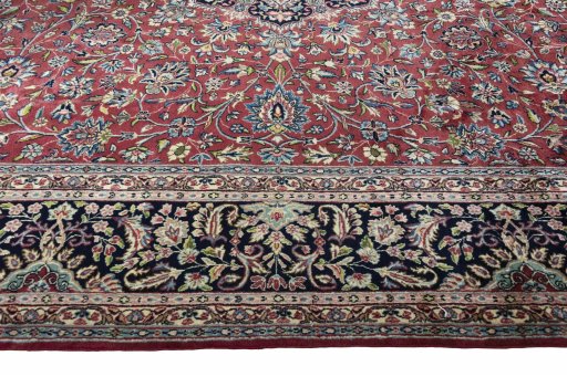 Corner detail of 2000s Kerman rug showing border pattern and Wool pile