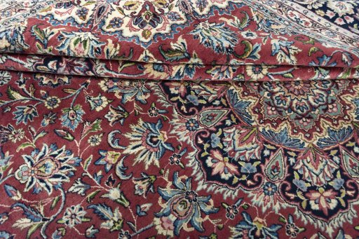 Close-up detail of 2000s Kerman rug from Iran / Persia showing Wool weave