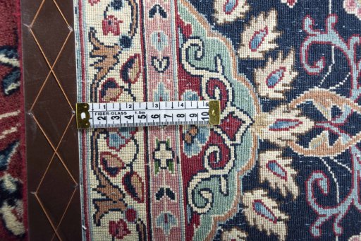 Backside of handmade 2000s Kerman rug showing knot structure and weave density