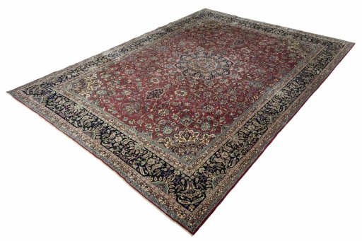 Corner detail of 2000s Kerman rug showing border pattern and Wool pile