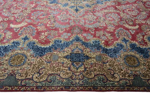 Corner detail of 1930s Kerman rug showing border pattern and Wool pile