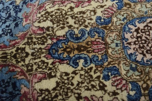 Close-up detail of 1930s Kerman rug from Iran / Persia showing Wool weave