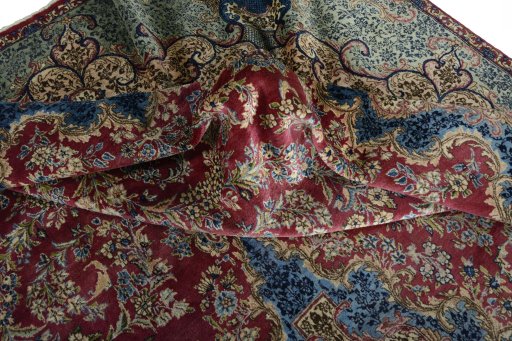 Backside of handmade 1930s Kerman rug showing knot structure and weave density