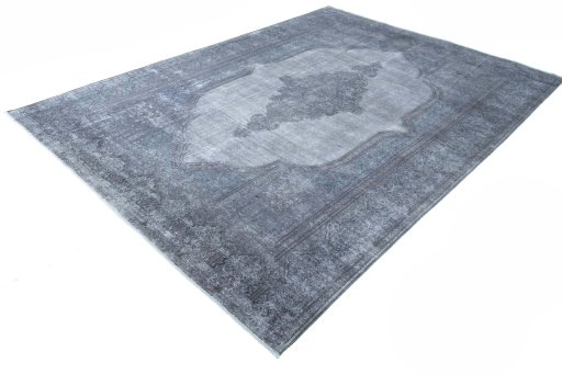 Corner detail of 1970s Kerman rug showing border pattern and Wool pile