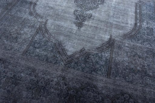 Close-up detail of 1970s Kerman rug from Iran / Persia showing Wool weave