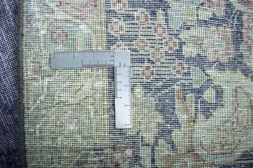 Backside of handmade 1970s Kerman rug showing knot structure and weave density