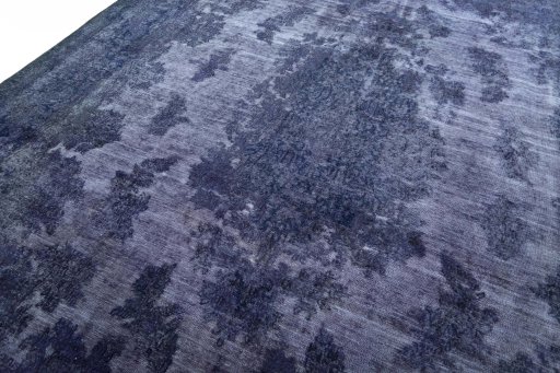 Backside of handmade 1970s Kerman rug showing knot structure and weave density