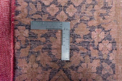 Backside of handmade 1970s Kerman rug showing knot structure and weave density
