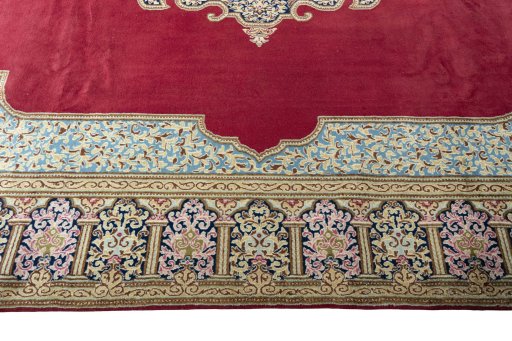 Corner detail of 2000s Kerman rug showing border pattern and Wool pile