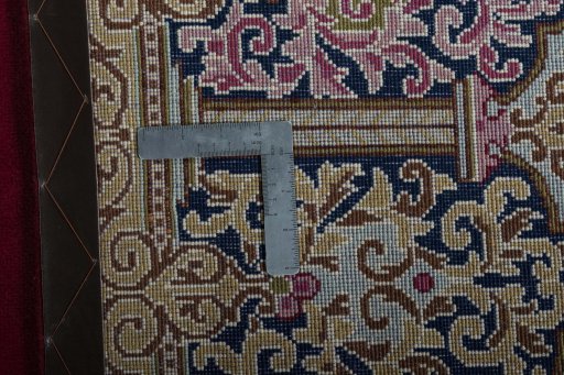 Backside of handmade 2000s Kerman rug showing knot structure and weave density
