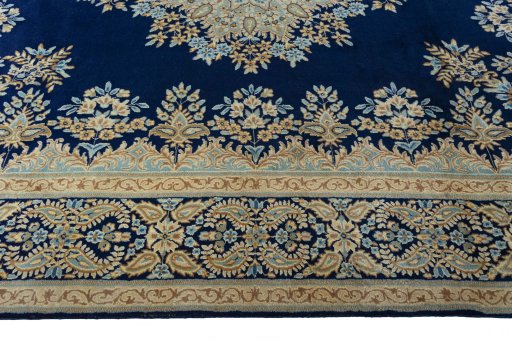 Corner detail of 2000s Kerman rug showing border pattern and Wool pile