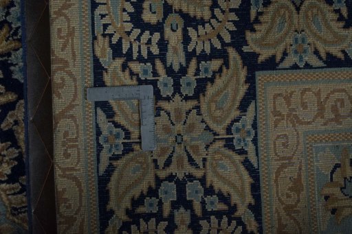 Backside of handmade 2000s Kerman rug showing knot structure and weave density