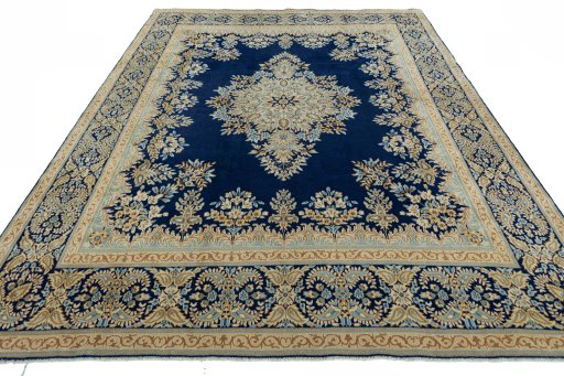 Surface texture of 2000s Kerman rug with natural Wool and intricate pattern