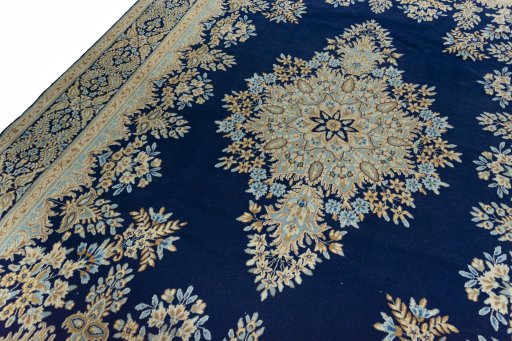 Backside of handmade 2000s Kerman rug showing knot structure and weave density