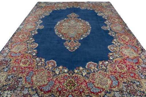 Surface texture of 1970s Kerman rug with natural Wool and intricate pattern
