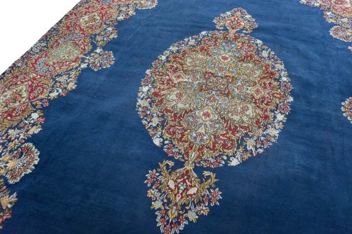 Backside of handmade 1970s Kerman rug showing knot structure and weave density