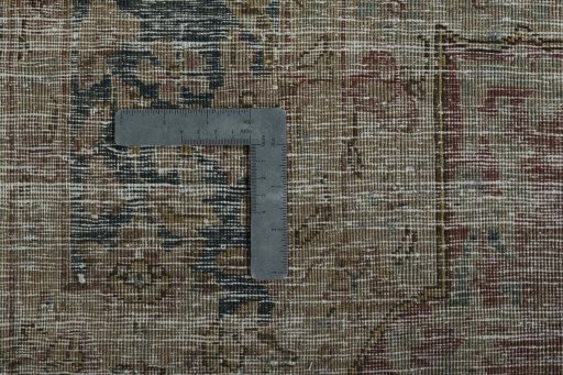 Backside of handmade 1950s Kerman rug showing knot structure and weave density