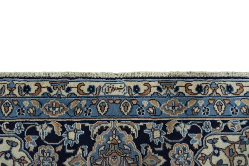 Corner detail of 2000s Kerman rug showing border pattern and Wool pile
