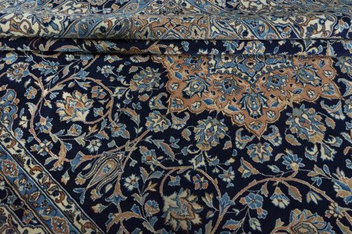 Surface texture of 2000s Kerman rug with natural Wool and intricate pattern