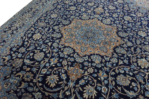 Backside of handmade 2000s Kerman rug showing knot structure and weave density