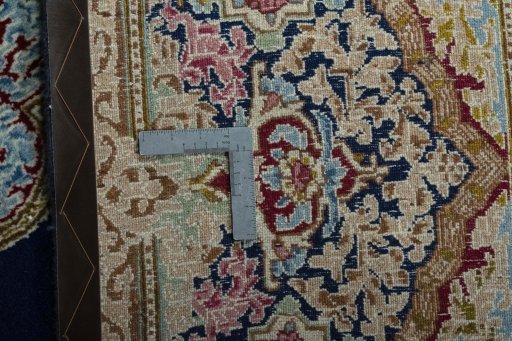 Backside of handmade 1970s Kerman rug showing knot structure and weave density