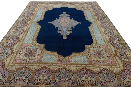 Surface texture of 1970s Kerman rug with natural Wool and intricate pattern