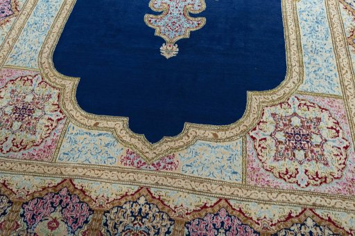 Close-up detail of 1970s Kerman rug from Iran / Persia showing Wool weave