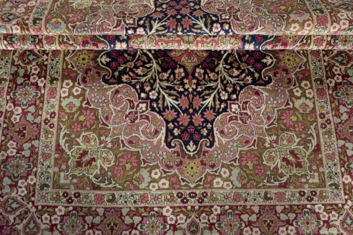 Corner detail of 1930s Kerman rug showing border pattern and Wool pile