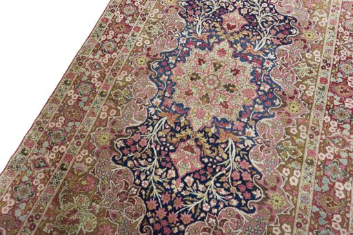 Backside of handmade 1930s Kerman rug showing knot structure and weave density